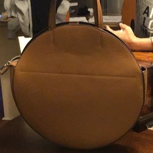 Carlos Santana Round Bag. 13” round. Caramel color